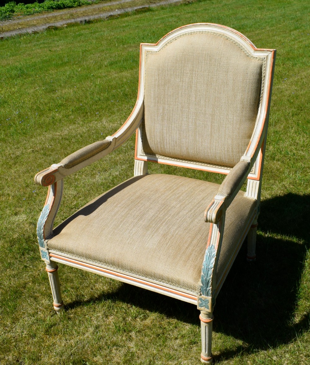 An early 20th-century French Louis XVI style fauteuil armchair featuring a painted off-white frame with fluted legs and beige herringbone fabric upholstery. View XI