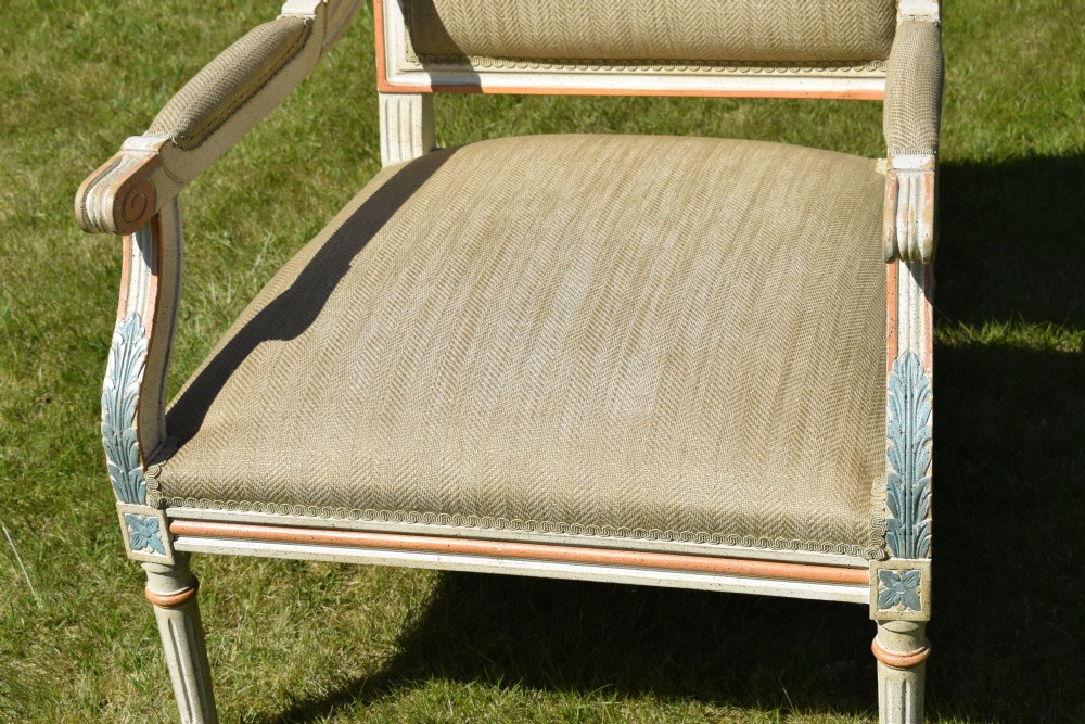 An early 20th-century French Louis XVI style fauteuil armchair featuring a painted off-white frame with fluted legs and beige herringbone fabric upholstery. View XII