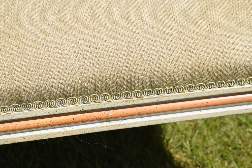 An early 20th-century French Louis XVI style fauteuil armchair featuring a painted off-white frame with fluted legs and beige herringbone fabric upholstery. View XVIII