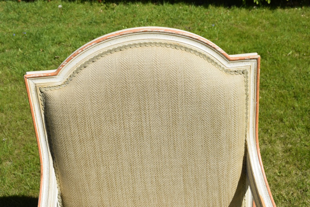 An early 20th-century French Louis XVI style fauteuil armchair featuring a painted off-white frame with fluted legs and beige herringbone fabric upholstery. View XXI