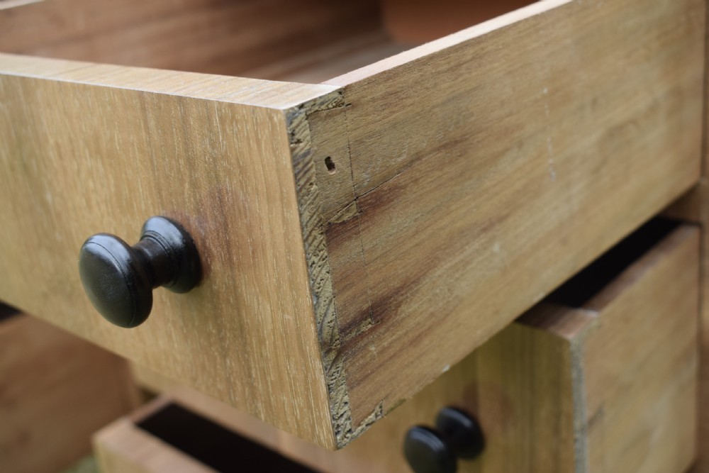 A matching pair of three-drawer walnut bedside chests featuring dark turned knobs and ebonised tapered legs. View XII
