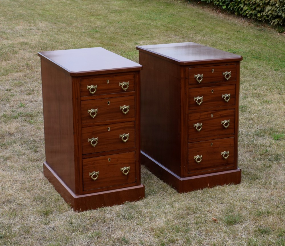A pair of Victorian mahogany four-drawer bedside chests featuring brass ring handles, escutcheons, and plinth bases. View III