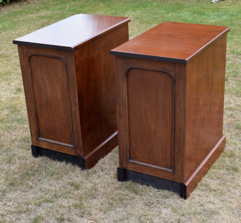 A pair of Victorian mahogany four-drawer bedside chests featuring brass ring handles, escutcheons, and plinth bases. View XIII