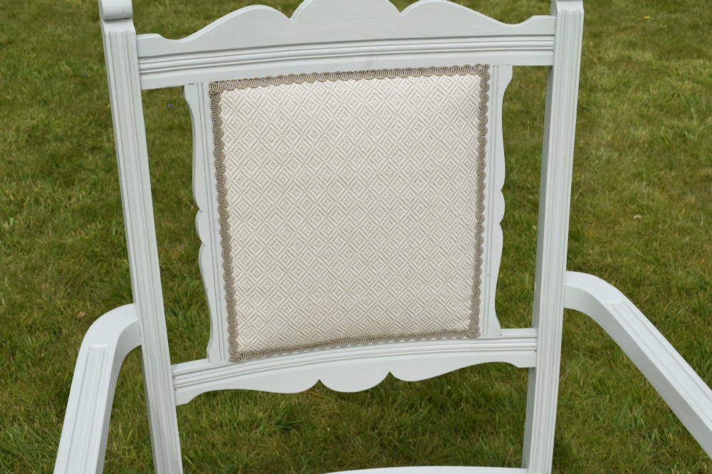 A pair of painted pale green Edwardian open armchairs featuring cream upholstered seats, padded backrest panels, turned front legs, and scalloped top rails. View VI