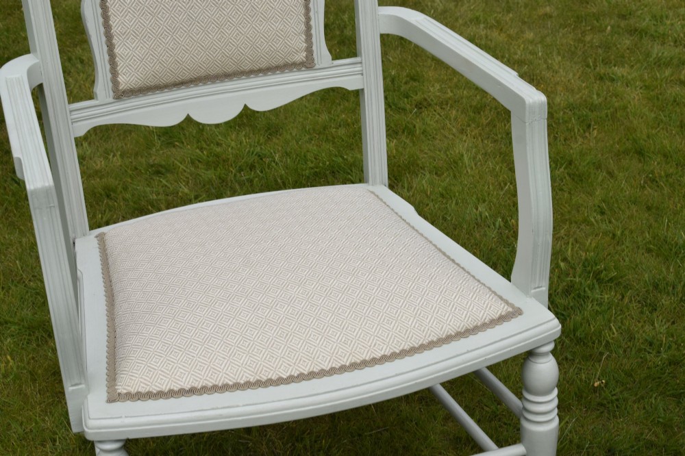 A pair of painted pale green Edwardian open armchairs featuring cream upholstered seats, padded backrest panels, turned front legs, and scalloped top rails. View XIII
