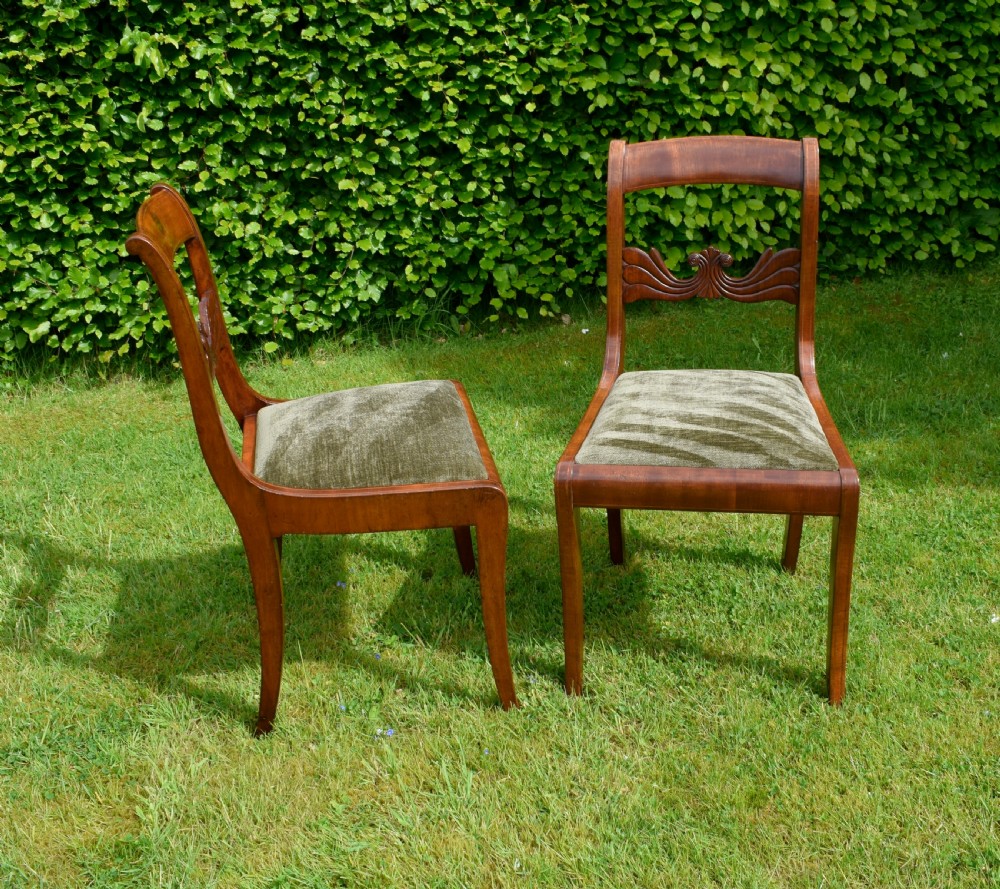 A pair of mahogany side chairs with curved tablet top rails, carved back splats, and green patterned upholstered seats. View VI