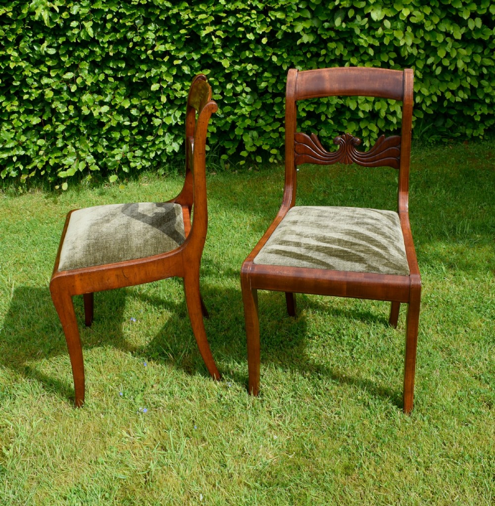 A pair of mahogany side chairs with curved tablet top rails, carved back splats, and green patterned upholstered seats. View VIII