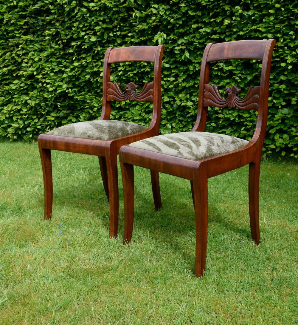 A pair of mahogany side chairs with curved tablet top rails, carved back splats, and green patterned upholstered seats. View XII