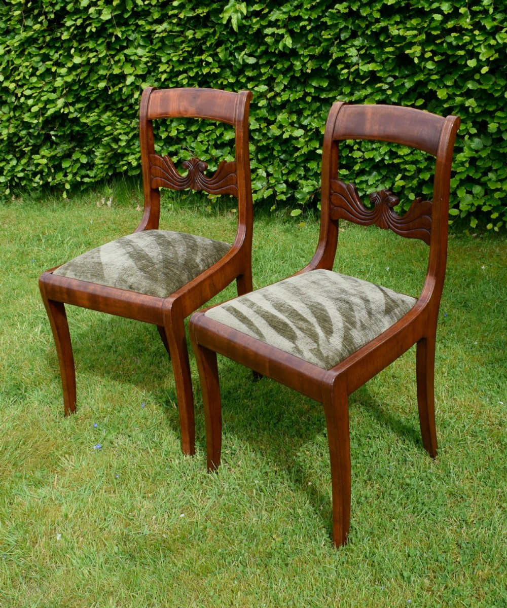 A pair of mahogany side chairs with curved tablet top rails, carved back splats, and green patterned upholstered seats. View XIII