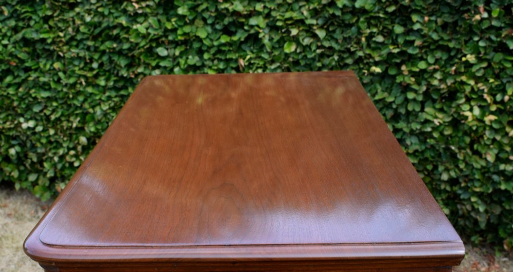 A Victorian burr walnut chest of drawers featuring two short over three long graduated drawers with turned wooden knobs and a solid plinth base. View XIII