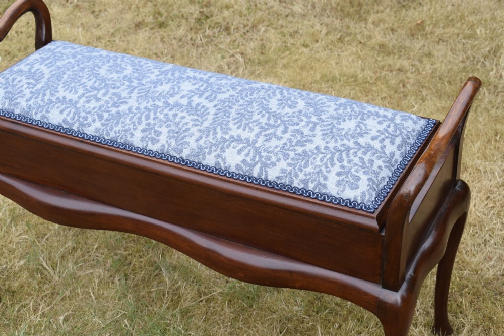 A mahogany duet piano stool with a blue patterned upholstered seat and carved cabriole legs. View VIII