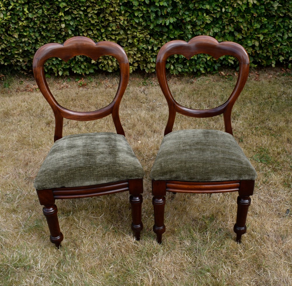A pair of Victorian mahogany crown back dining chairs with green velvet upholstered seats and turned front legs. View XIII