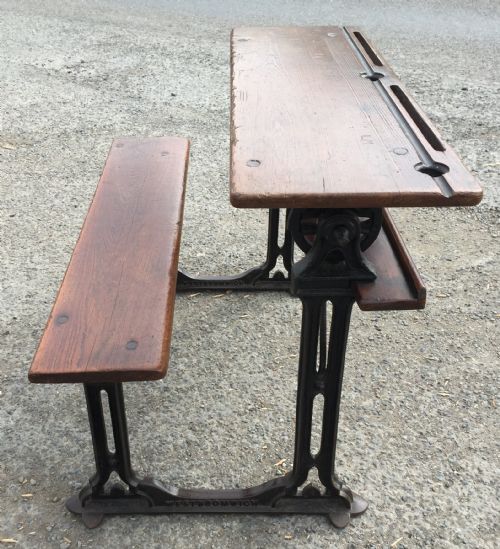 CIRCA 1900 DOUBLE SEAT SCHOOL DESK WITH ELM TOP AND SEAT ON CAST IRON BASE - ADDITIONAL PHOTO 1