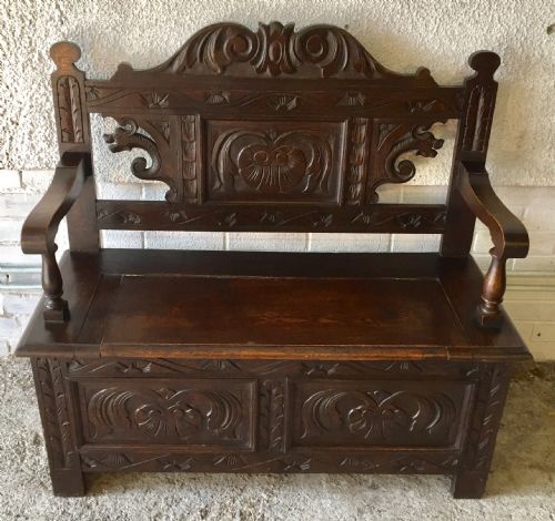 CIRCA 1900 CARVED OAK HALL BENCH WITH LIFT UP SEAT - ADDITIONAL PHOTO 1