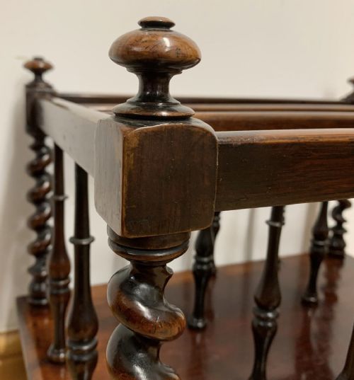 EARLY VICTORIAN ROSEWOOD CANTERBURY WITH EBONISED KNOBS AND STANDING ON BRASS CASTORS - ADDITIONAL PHOTO 2
