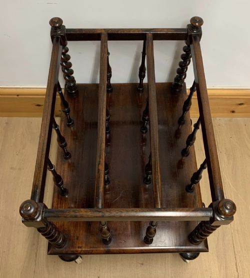 EARLY VICTORIAN ROSEWOOD CANTERBURY WITH EBONISED KNOBS AND STANDING ON BRASS CASTORS - ADDITIONAL PHOTO 3
