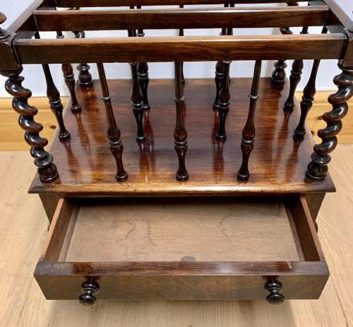 EARLY VICTORIAN ROSEWOOD CANTERBURY WITH EBONISED KNOBS AND STANDING ON BRASS CASTORS - ADDITIONAL PHOTO 4