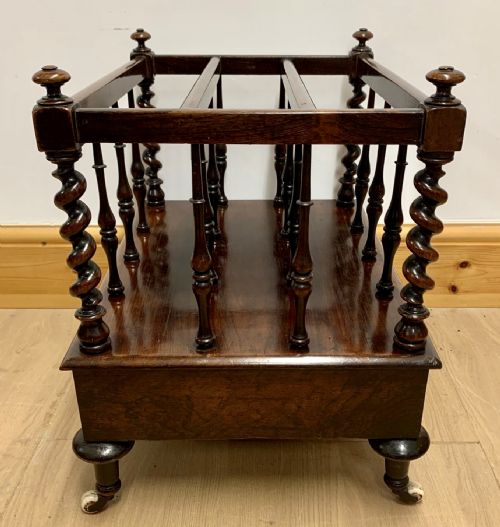 EARLY VICTORIAN ROSEWOOD CANTERBURY WITH EBONISED KNOBS AND STANDING ON BRASS CASTORS - ADDITIONAL PHOTO 6