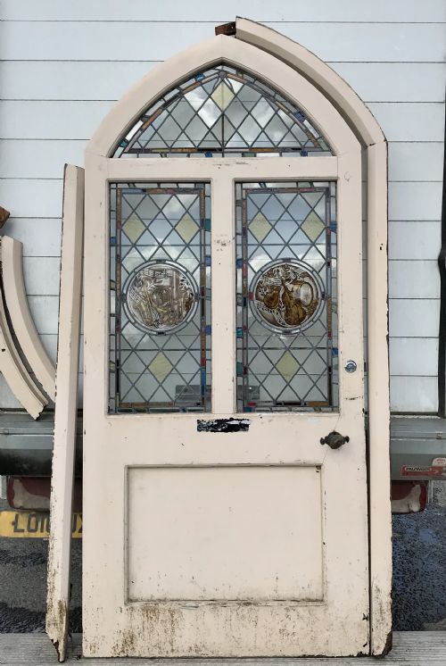 VICTORIAN ARCH TOP EXTERNAL PINE DOOR WITH STAINED GLASS PANELS DEPICTING MUSICAL INSTRUMENTS AND ORIGINAL FRAME - ADDITIONAL PHOTO 1