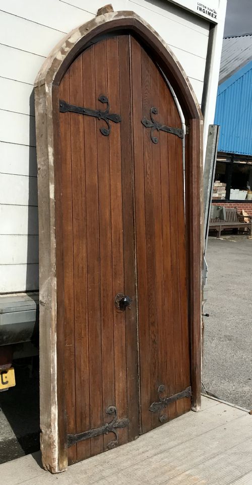 PAIR OF 19TH CENTURY ARCH TOP OAK DOORS WITH DECORATIVE HINGES AND HANDLES AND FRAME - ADDITIONAL PHOTO 17