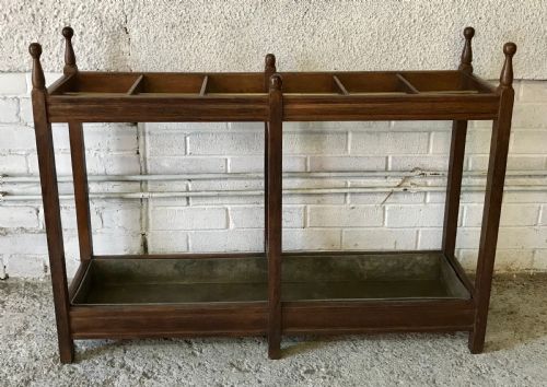 EDWARDIAN OAK DOUBLE STICK STAND WITH CENTRAL BRASS RAIL AND TURNED FINIALS - ADDITIONAL PHOTO 1