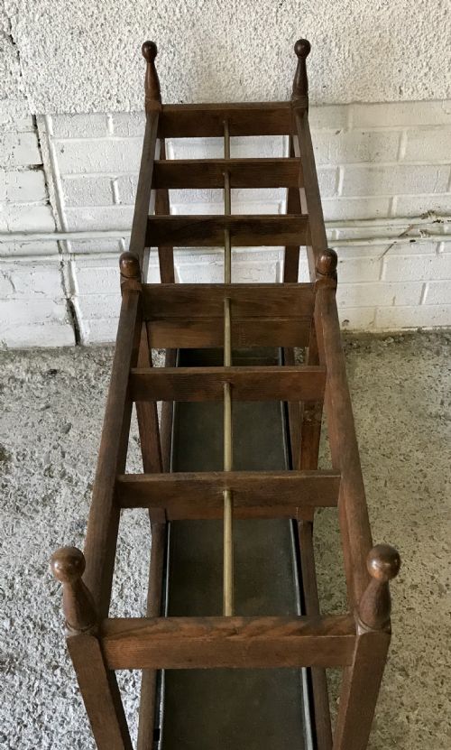 EDWARDIAN OAK DOUBLE STICK STAND WITH CENTRAL BRASS RAIL AND TURNED FINIALS - ADDITIONAL PHOTO 9