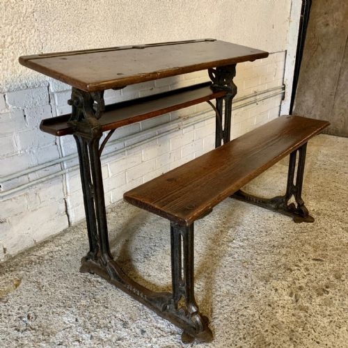 circa 1900 double seat school desk with elm top and seat on cast iron base - CATEGORY: ANTIQUE DESKS - DATED 1900