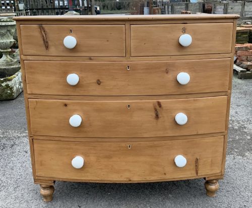early victorian pine bow front chest of drawers with original porcelain knobs - CATEGORY: ANTIQUE CHEST OF DRAWERS - DATED VICTORIAN