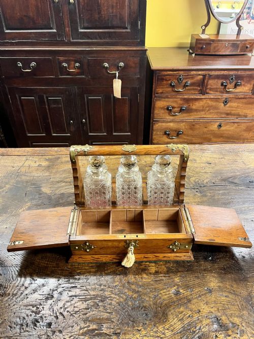 VICTORIAN OAK TANTALUS WITH THREE CUT GLASS DECANTERS - ADDITIONAL PHOTO 6