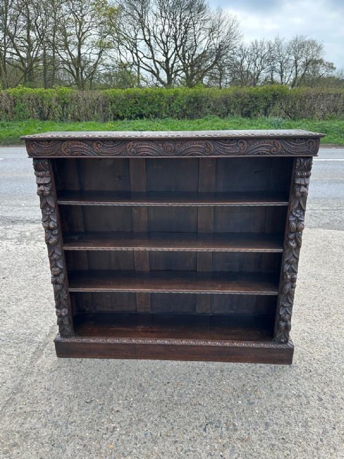 victorian carved oak open bookcase with foliate green man mask carvings - CATEGORY: ANTIQUE BOOKCASES - DATED VICTORIAN