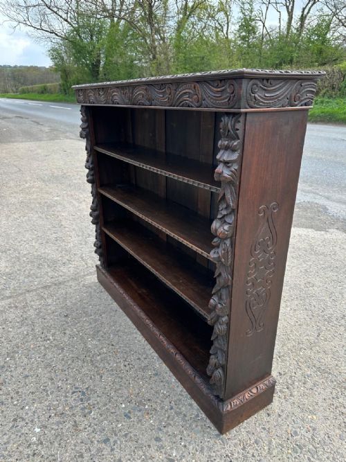 VICTORIAN CARVED OAK OPEN BOOKCASE WITH FOLIATE GREEN MAN MASK CARVINGS - ADDITIONAL PHOTO 1