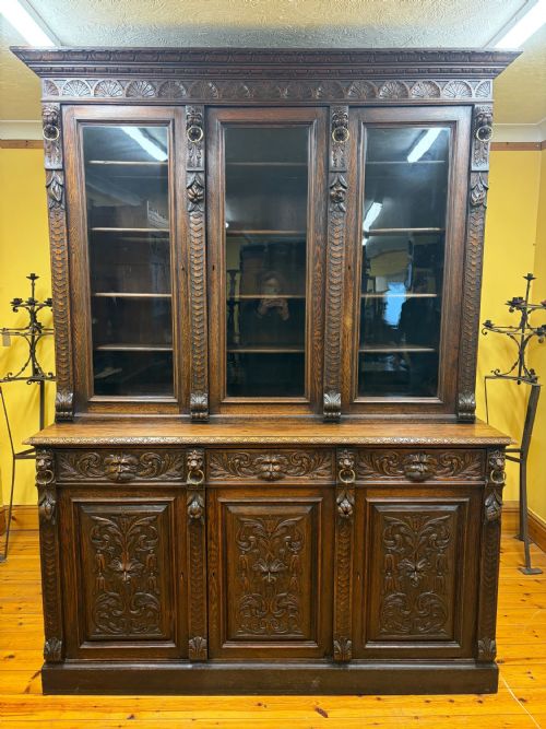 19TH CENTURY VICTORIAN MONUMENTAL CARVED OAK LIBRARY BOOKCASE WITH INTRICATE CARVINGS - ADDITIONAL PHOTO 1