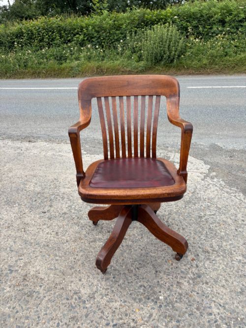 1920S OAK SWIVEL DESK CHAIR ON CASTORS
