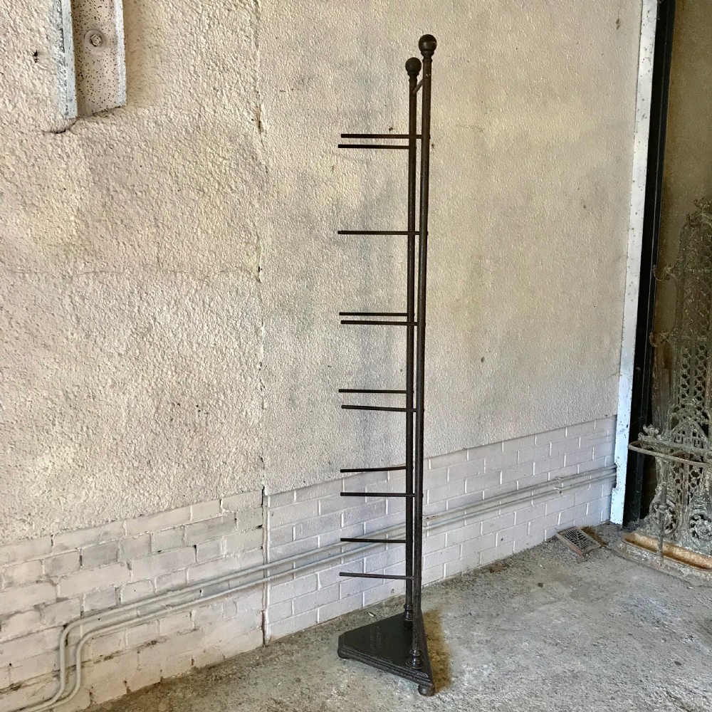 Circa 1900 Shop Display Stand made of Iron and with Brass Finials 