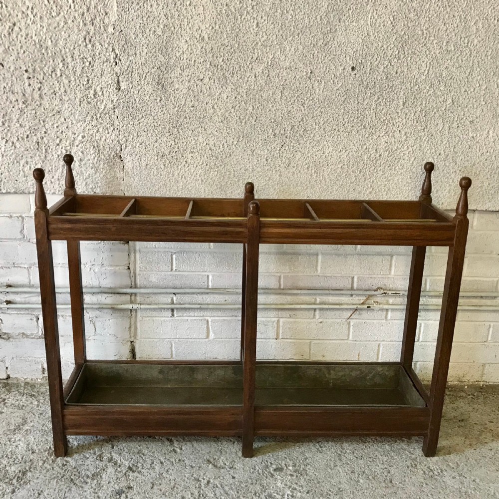 Edwardian Oak Double Stick Stand with Central Brass Rail and Turned Finials