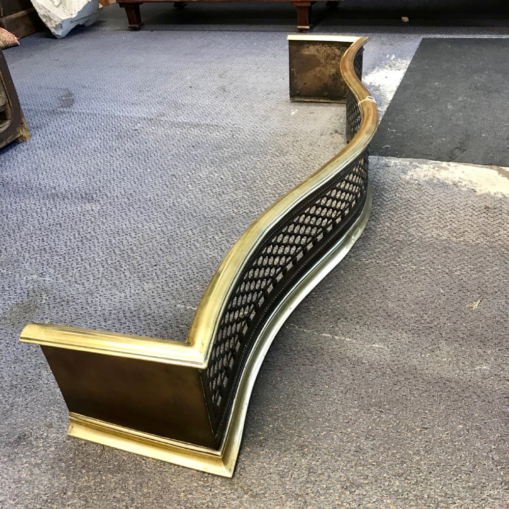 19th Century Brass and Iron Serpentine Fender 