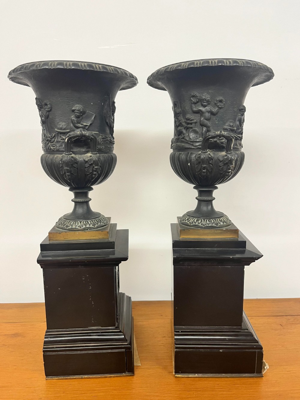 A Pair of Bronze Urns on Marble Plinths View II