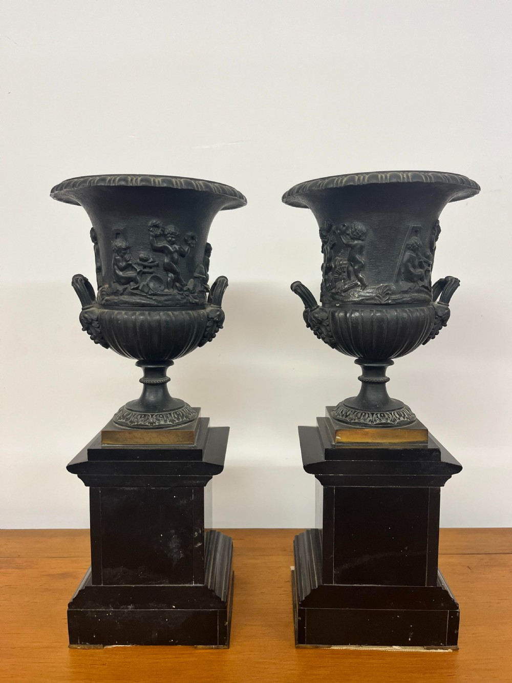 A Pair of Bronze Urns on Marble Plinths View III