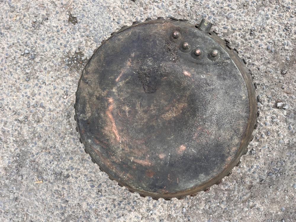 A large 19th-century copper wash boiler with heavy hand-hammered rivets along the seams and a dark oxidised patina. View VI