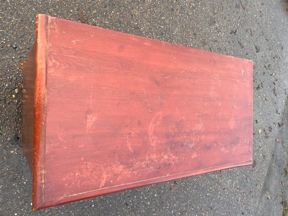 A Victorian painted pine chest of drawers featuring a two-over-two drawer layout, turned wooden knobs, turned feet, and a distressed reddish-brown finish. View XIII