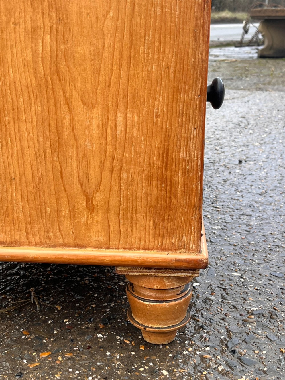 A Victorian pine chest of drawers featuring two short drawers over three long graduated drawers with turned wooden knobs and bun feet. View VIII