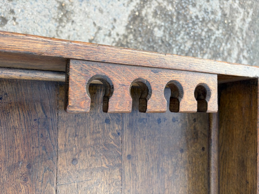 A 1920s solid oak post office sorting table featuring a raised top gallery, single drawer, and an open lower shelf. View III