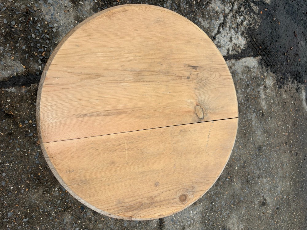 A nineteenth-century pine cricket table featuring a circular top supported by three bobbin-turned legs. View III