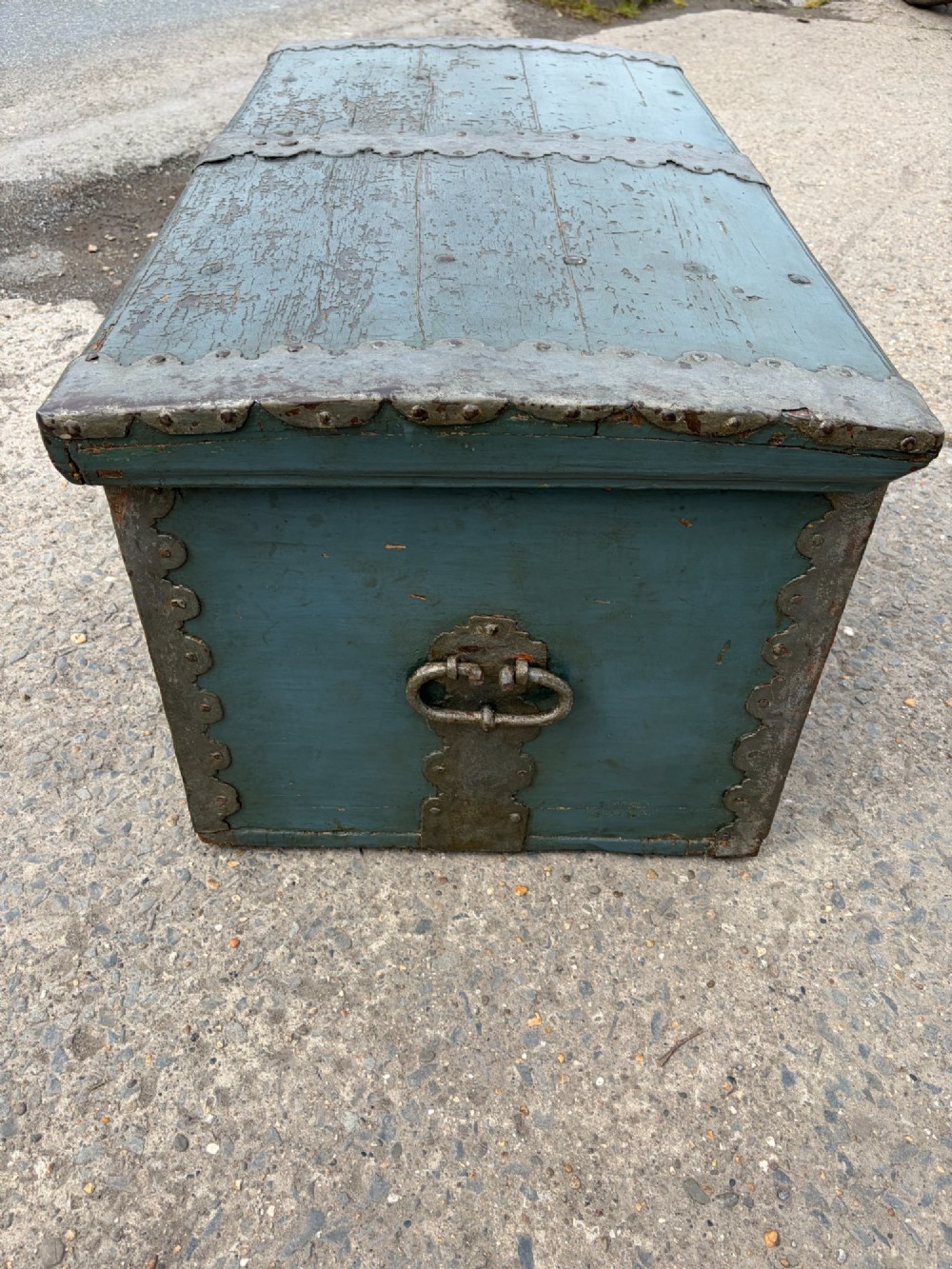 A 19th-century wooden storage chest featuring a curved dome lid, original blue-grey paint finish, and decorative iron strapwork. View VIII