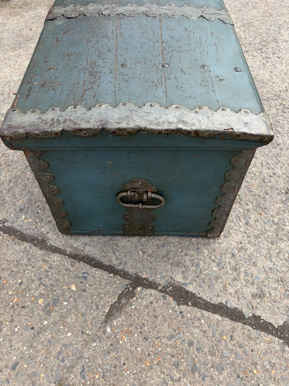 A 19th-century wooden storage chest featuring a curved dome lid, original blue-grey paint finish, and decorative iron strapwork. View IX