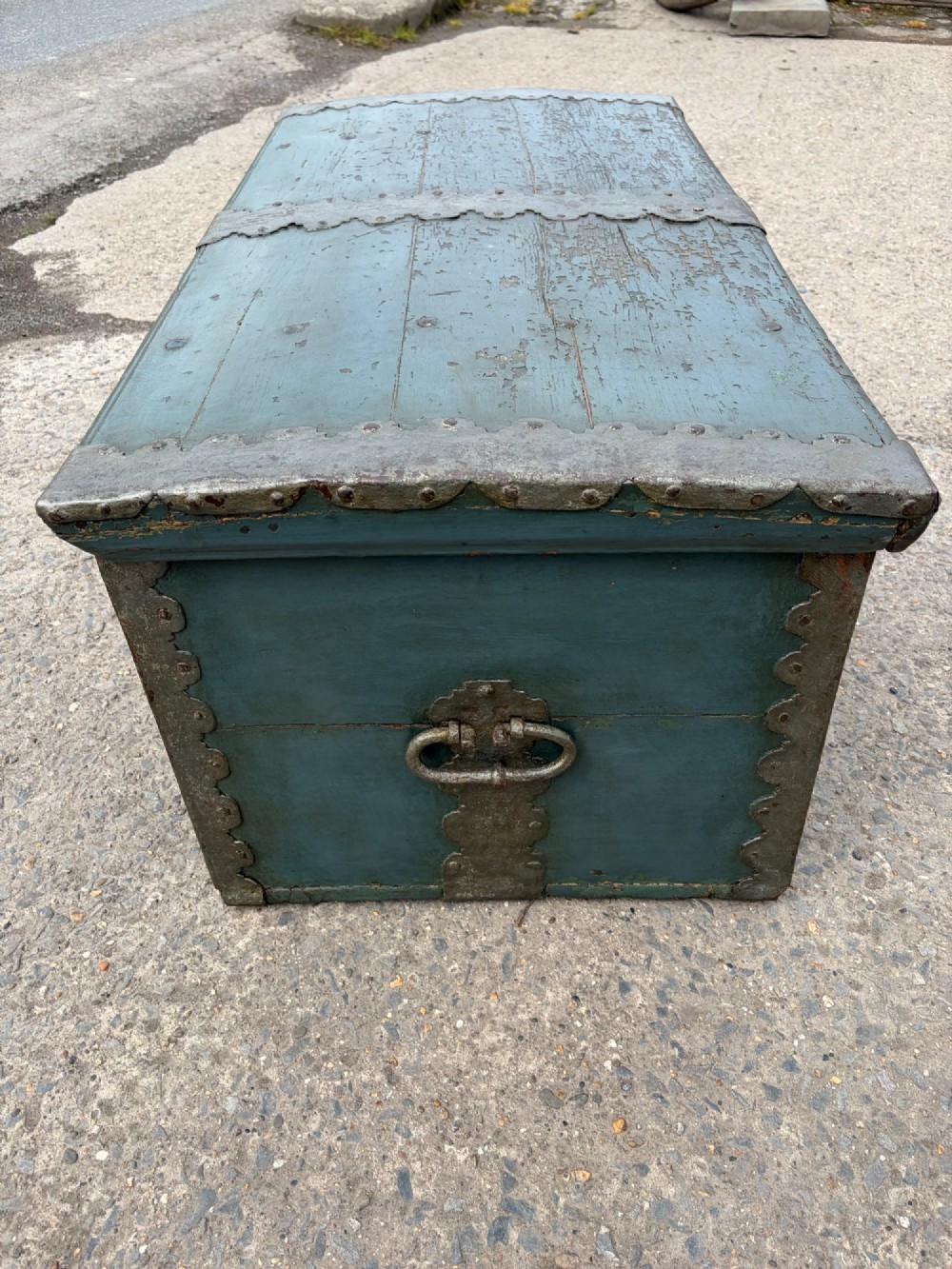 A 19th-century wooden storage chest featuring a curved dome lid, original blue-grey paint finish, and decorative iron strapwork. View X