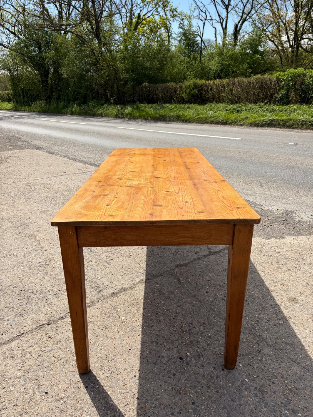 A rectangular Victorian pine table featuring four tapered square legs and a single drawer set into the front frieze. View II