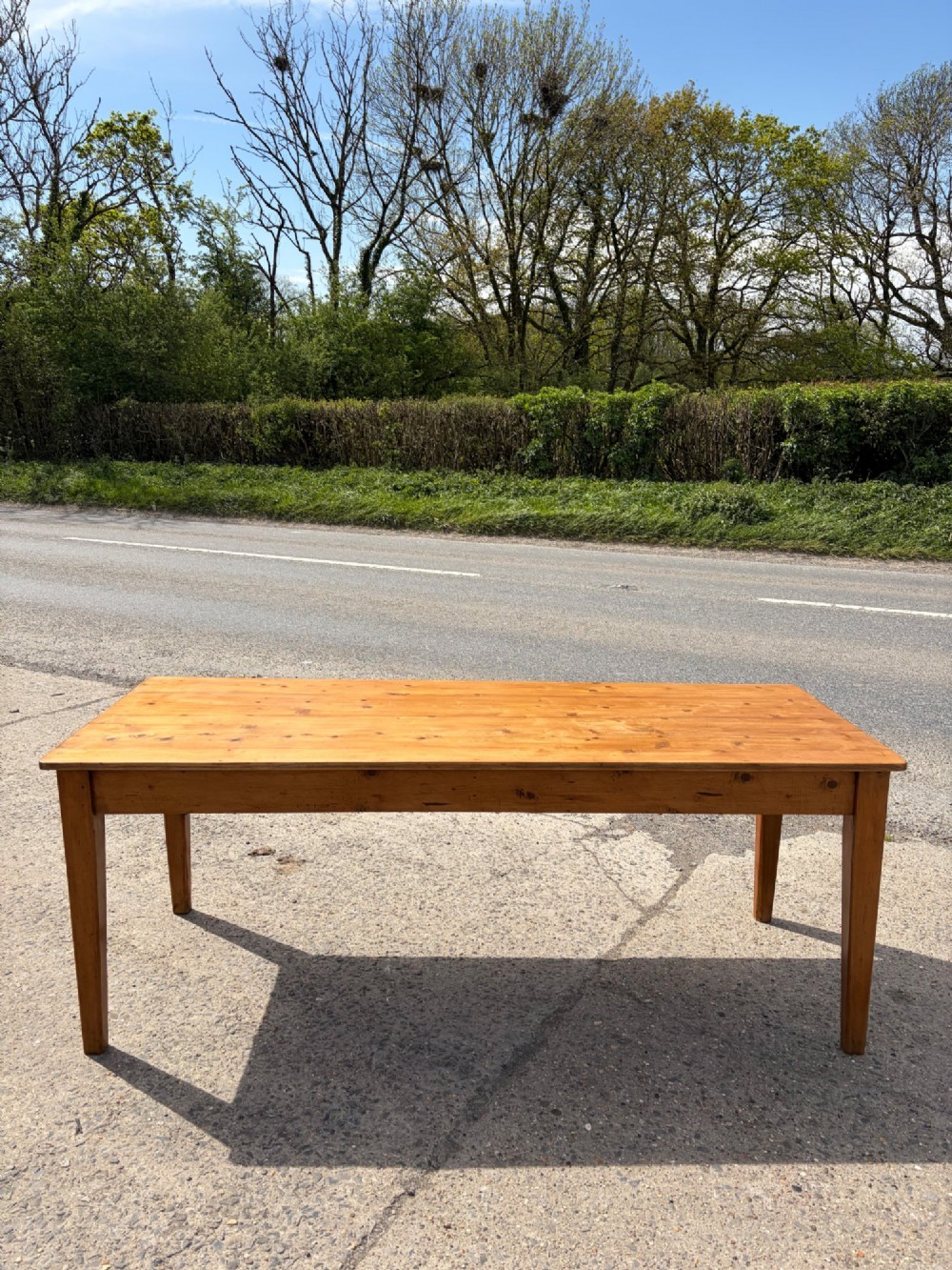 A rectangular Victorian pine table featuring four tapered square legs and a single drawer set into the front frieze. View III