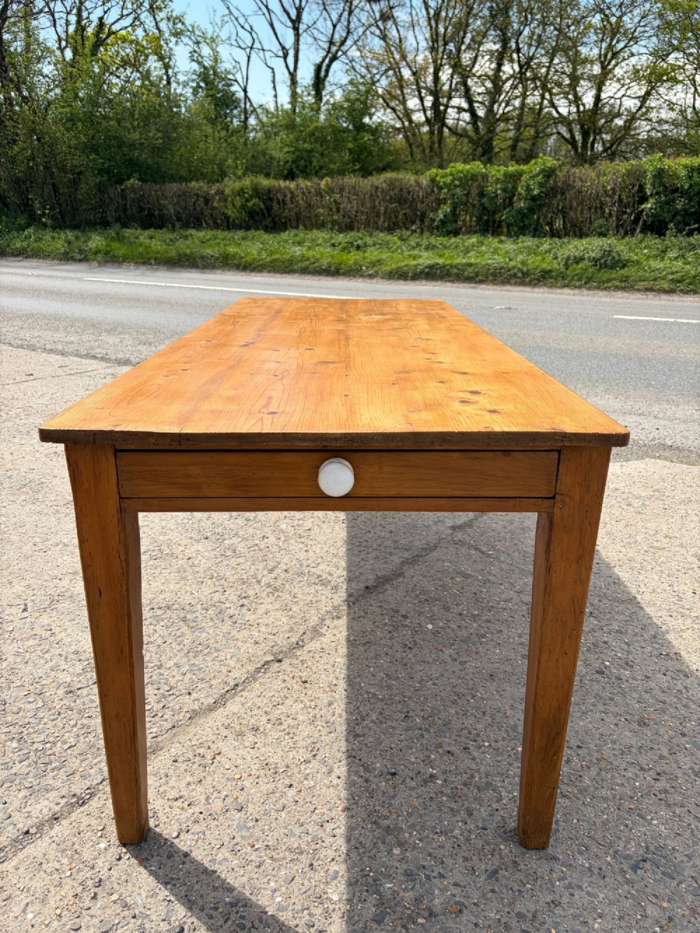 A rectangular Victorian pine table featuring four tapered square legs and a single drawer set into the front frieze. View IV