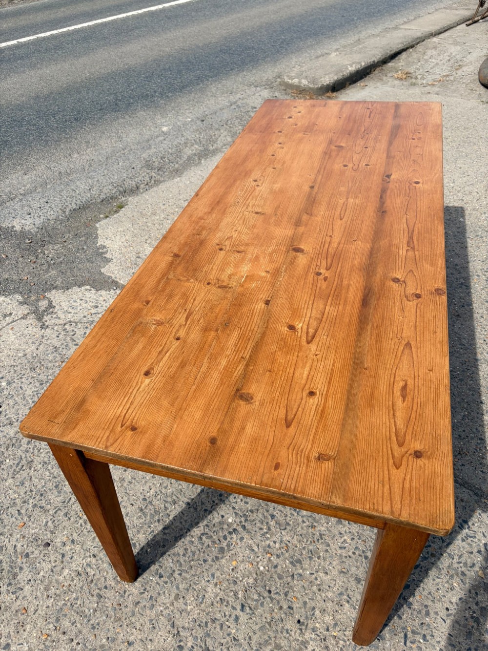 A rectangular Victorian pine table featuring four tapered square legs and a single drawer set into the front frieze. View V
